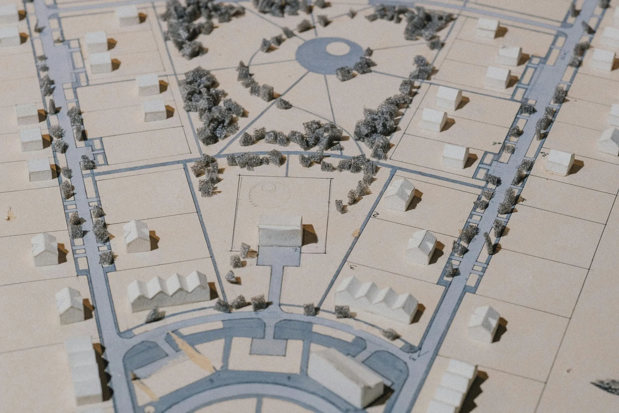 Architectural scale model of a neighbourhood plan with streets, houses and a central park