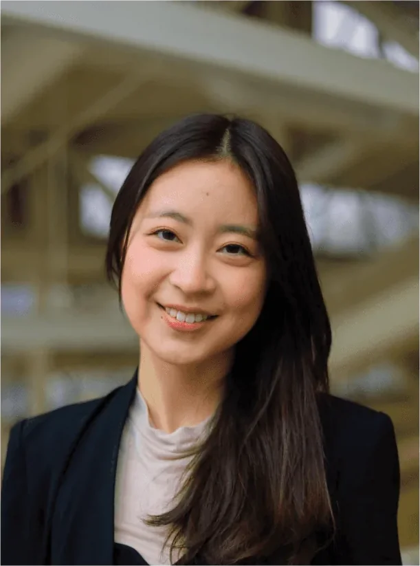 Jenny Yang Yi, Young Guns Studio class of 2016, smiling in a dark blazer